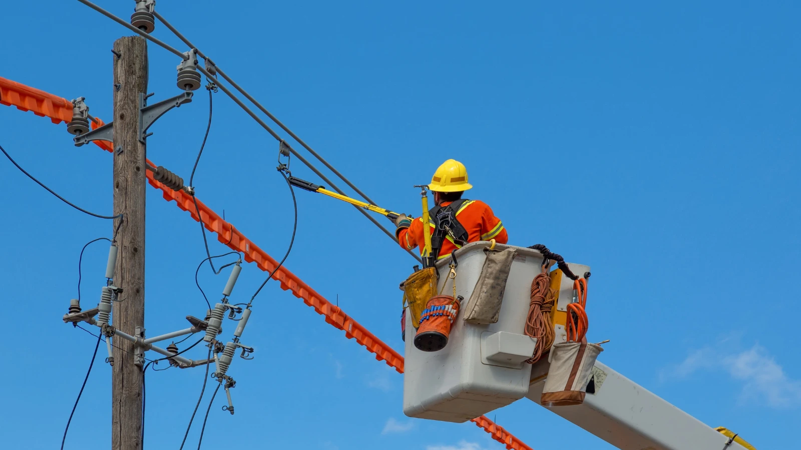 energy and utilities man fixing hydro